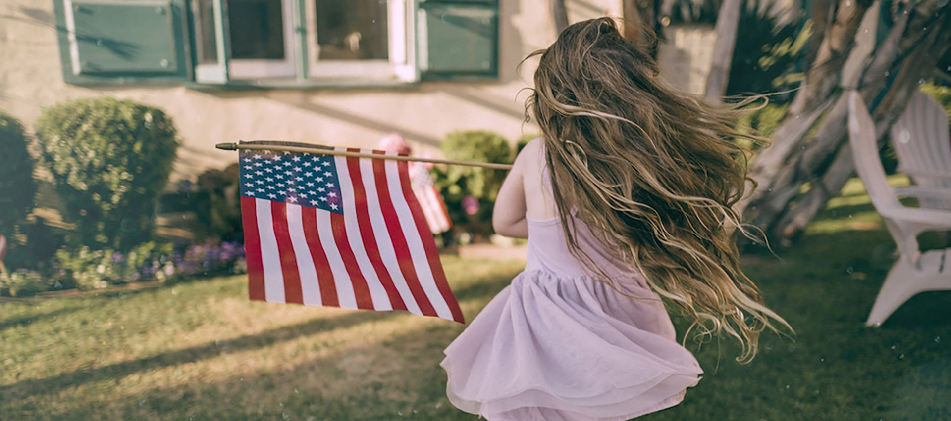 image of a little girl with an American flag