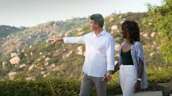 Image of a couple walking around Mountain House near homesite 699