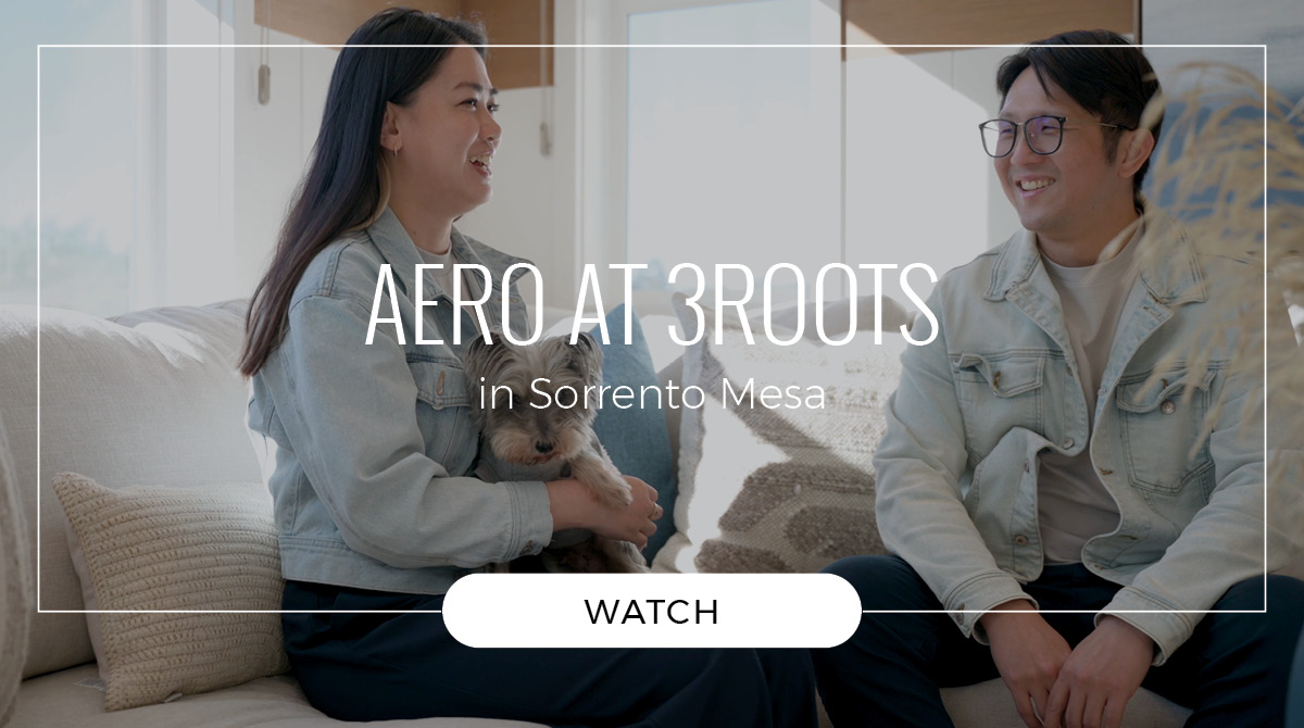 Image of a couple sitting in the plan 3 living room at AERO