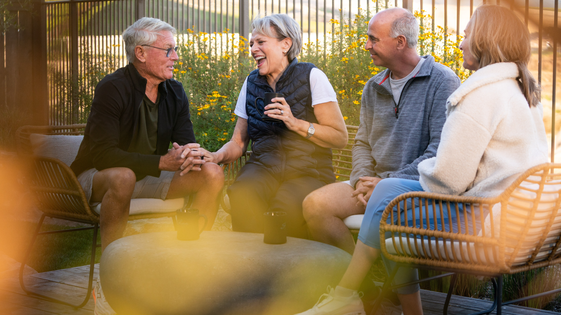 Image of two couples laughing together 